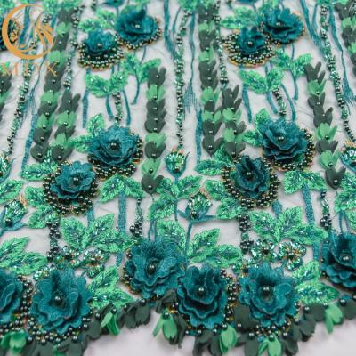 中国 敏感な水溶性の花のレースの生地の刺繍はウェディング ドレスのための材料をひもで締める 販売のため