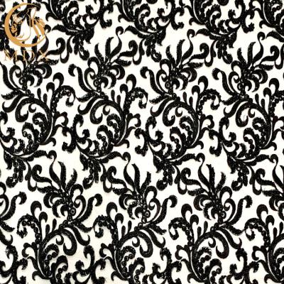 China Garment Black Embroidered Handmade Lace Fabric Pearls Decoration for sale