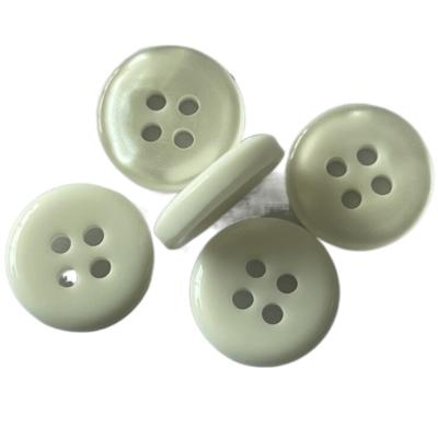 China 16L Plastic Shirt Buttons With Pearl Effect Chalk Back Off White Color 4 Hole for sale