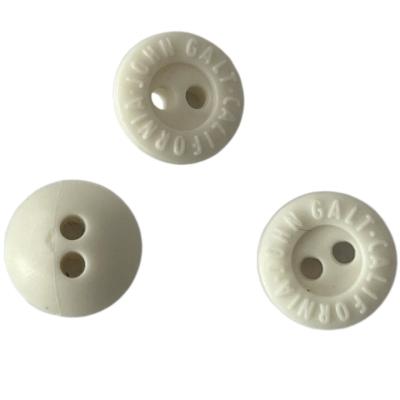 China 2 Hole Off White Rubber Buttons 11mm Engraved Logo Use On Sewing Clothing for sale