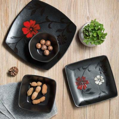 China EEC Glaze Black Ceramic Dinnerware Reactive With Flower Patten for sale