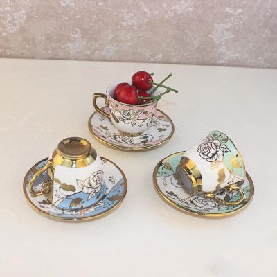 China Couple Pair Smiling Face Coffee Ceramic Cup And Saucer Set Gold Plated for sale