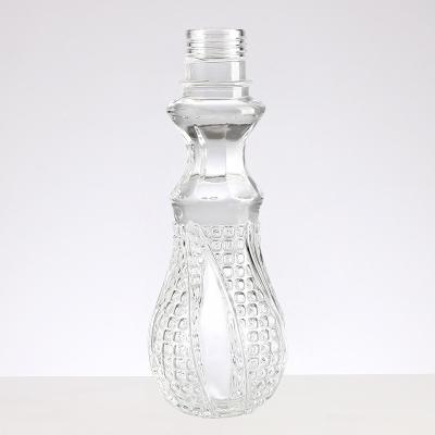 China Glass Small Wine Bottle with Embossed Engraved Mini Liquor Decanter Stopper Lid 50ml 100ml for sale