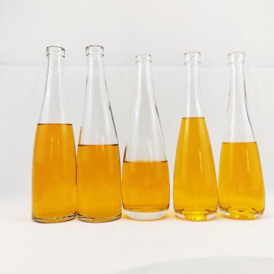 China Customized Shape Mineral Packaging Glass Bottles with Cork Supply Bulk Sale 330ml 520ml for sale