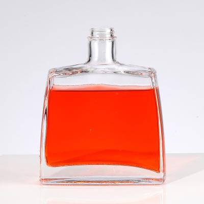 China Glass Base Material 750ml 700ml 550ml Gin Glass Bottle Rum Brandy Glass Liquor Bottle with Lid for sale