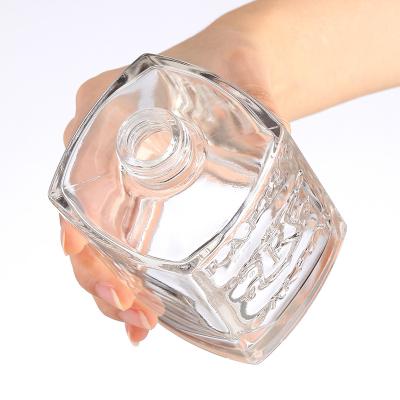 China Pattern Customized Logo Clear Glass 700ml Square Bottle for Wine and Beer Empty in Carving Patterns for sale