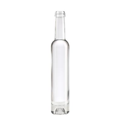 China Clear 750ml Tequila Empty Wine Bottle with Lid and Hot Stamping Surface Handling Tesla for sale