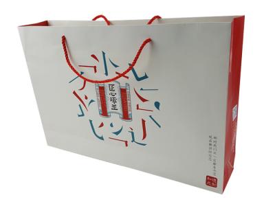 Китай Paper Shopping Bags Custom Design Cardboard Material Logo Printing Paper Bag with Red Color Rope Handle продается