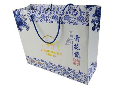 China Blue Color Printing Logo Gold Hot Stamping Customized Size OEM Design Paper Shopping Bag with Handle for sale
