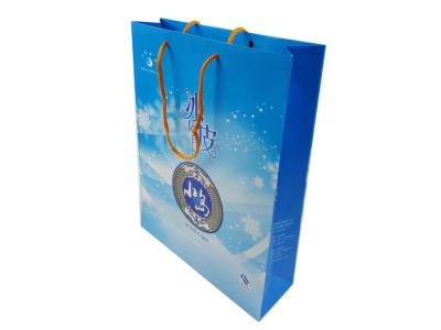 中国 Blue Color Printing Customized Size Custom Design Logo Printing Cardboard Material Paper Bags with Handle 販売のため