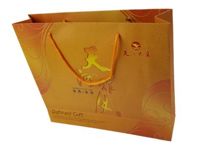 China Gold Color Paper Printing Customized Logo Embossing Rigid Cardboard Material Big Size Custom Design Paper Bags for sale