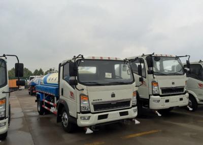 China Sprinkling Truck 5 - 8CBM SINOTRUK HOWO Light Duty Truck Chassis For Road Flushing for sale
