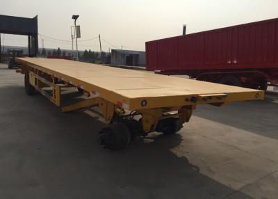 中国 Mnの鋼鉄3車軸30t重い商品を運ぶ平面貨物トレーラー 販売のため