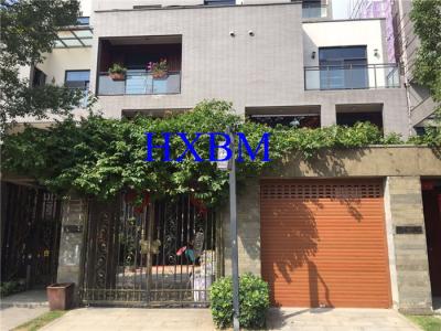 China Remote Control Aluminium Garage Doors Automatic Roll Up With Wood Color Finishing for sale