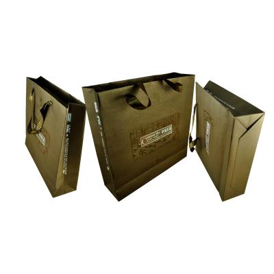 China Customized Flat Handle Paper Bag , Spot UV Finishing Brown Paper Packaging Bags for sale