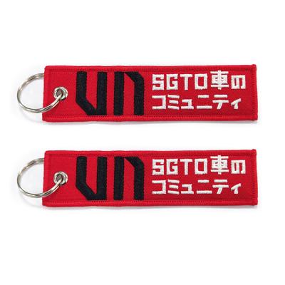 China Custom Flight Tag Embroidered Key Chains PMS Color With Metal Ring for sale