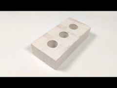 white brick of wall building construction brick with 3 holes