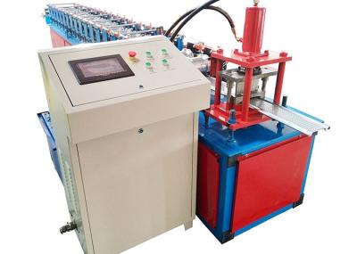 China Hydraulic Cutting Ppgi Shutter Door Roll Forming Machine With Punching for sale