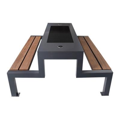 China Outdoor Solar Table And Bench Black Metal Wood Bench With Solar Panel for sale