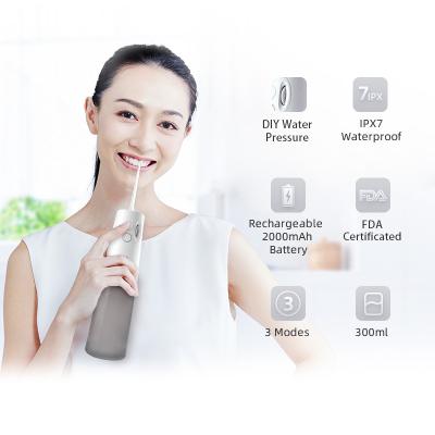 中国 電気携帯用歯の洗剤IPX7 1400 RPMコードレス水デンタルフロス口頭ウォーターピック 販売のため