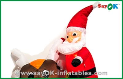 China Cute Christmas Santa Father Inflatable Christmas Decoration Riding A Black Bear for sale