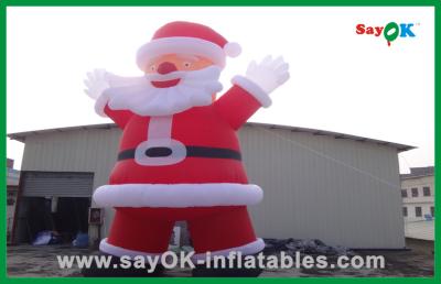 China Custom Red Inflatable Christmas Santa Claus With Bread Inflatable Cartoon Character for sale