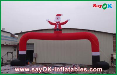 China Christmas Outdoor Big Red Inflatable Christmas Arch With Christmas Man for sale