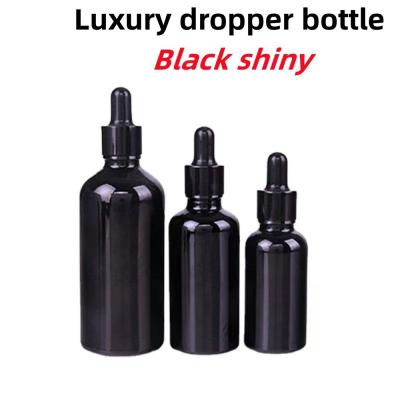 China 5ml Black Glass Dropper Bottle OEM 15 Ml Amber Glass Bottles for sale
