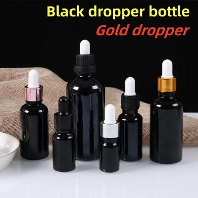 China 5ml 10ml 15ml 20ml Essential Oil Serum Flat Shoulder Round Shiny essential oil bottle Black Glass Dropper Bottle for sale