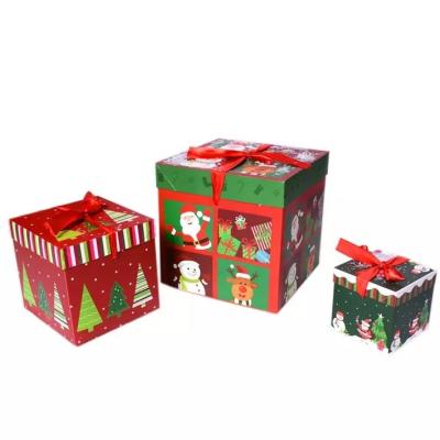 China Lid And Base Christmas Cardboard Gift Boxes Christmas Decorations Box With Ribbon for sale