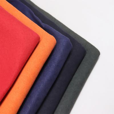 Китай TGKELL выбило мягкий тканевый материал багажа PVC ткани Microfiber кожаный продается