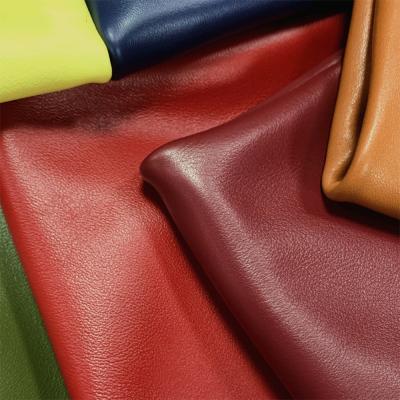 China ODM PVC Faux Leather Fabric Apparel 1.65mm Reddish Brown PU Leather Fabric for sale