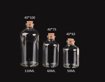 Chine le verre de bonne qualité de 40mm cogne des bouteilles avec le couvercle de liège, pour des messages, épousant le souhait, des bijoux à vendre