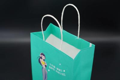China Custom Kraft Paper Packaging Bag Personalized Printed Paper Bags With Handles for sale