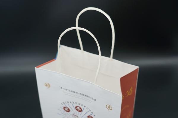 Quality OEM Kraft Paper Shopping Bags biodegradable Paper Kraft Bags With Handles for sale