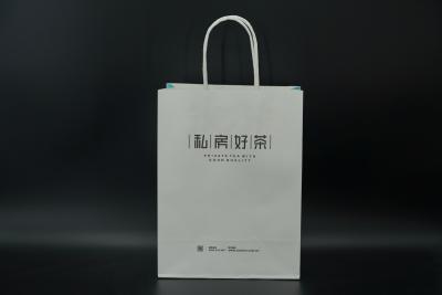 China Durable Tea Packaging Paper Bags Lightweight White Gift Bags With Handles for sale