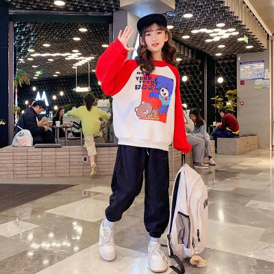 中国 デリケートで柔らかい小さな女の子の服の色合わせカジュアルラウンドネックジャンパー 販売のため