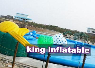 China Custom 0.9mm PVC Inflatable Water Parks Pool With Slide And Toys On Land for sale