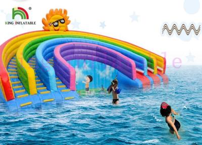 China Anti - UV Inflatable Water Parks Triple Lanes PVC Rainbow Slide With Swimming Pool For Rentals for sale