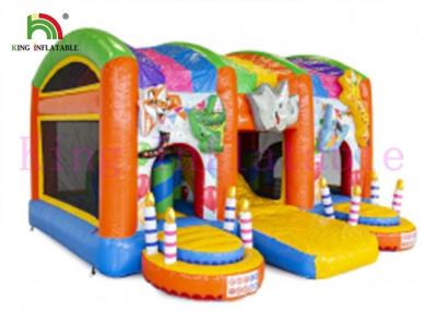 China Colorful Jungle Wild Animal PVC Inflatable Jumping Castle With Slide For Kids for sale
