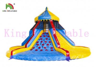 China PVC Colorful Blow Up Carousel Dry Slide Tower Slide With Climbing Wall For Kids for sale