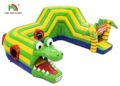China Jogos infláveis infláveis dos esportes do curso de obstáculo do crocodilo 6.5x5.5m verde exterior à venda