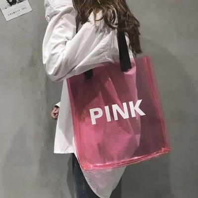 China Custom woman clear pink pvc laser transparent shiny handbags lady shoulder beach summer pvc tote bags with custom printe for sale