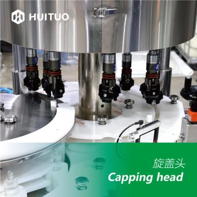 Chine Machine de capsulage automatique Huituo 7200bph pour huile pour bébé à capuchon rond à vendre