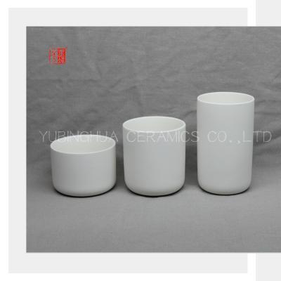 China Various Size White Ceramic Candle Jar With Inside Glaze Embossing Printing for sale