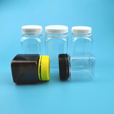 Chine la nourriture en plastique de la médecine 320ml cogne la bouteille carrée d'ANIMAL FAMILIER de miel avec le chapeau évident de bourreur à vendre