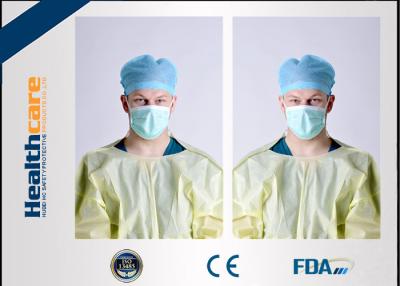 China Yellow Disposable Isolation Gowns One Time Use Knitted Cuff Barrier Gowns Against Liquid for sale