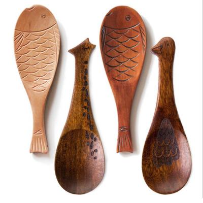 China Japanese handcrafted custom fish shaped nanmu wooden spoon for children for sale