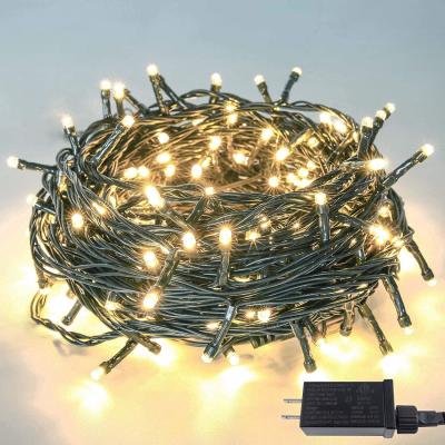 China Waterproof  Plug In 700 Warm White Fairy Lights Green Cable 120V 70m Waterproof For Christmas Tree for sale