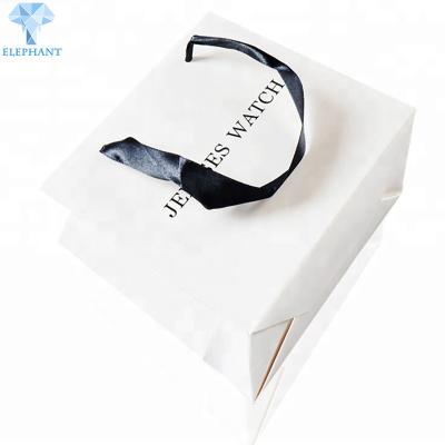 China C2S Art Paper White Gift Bags With Handles 20×21×8cm Apparel Packaging for sale